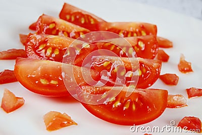 sliced cherry tomatoes on a white terelka. close up. vegetarian healthy food. Stock Photo