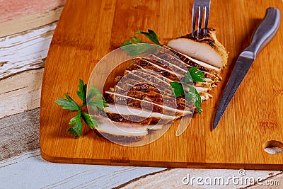 Sliced Chicken Breast fillet selective focus on wooden background Stock Photo