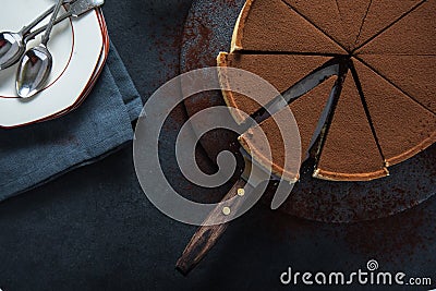 Sliced chocolate tort on dark background Stock Photo