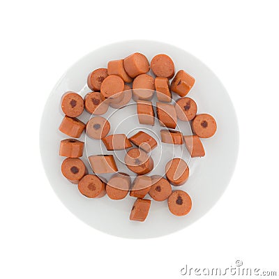 Sliced cooked hot dogs on a white plate Stock Photo