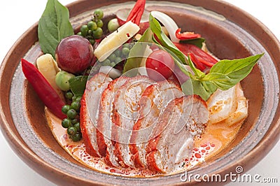 Sliced duck with chily, grapes and cherry tomato Stock Photo