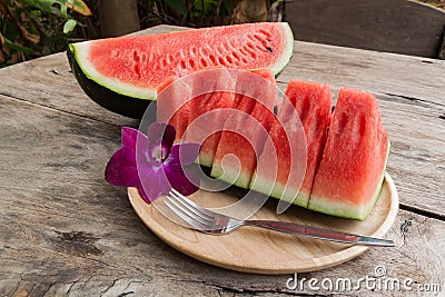 Sliced Fresh water melons on wood plate Stock Photo