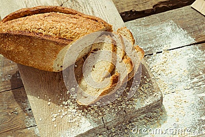 Sliced gluten free bread on wooden table. Stock Photo