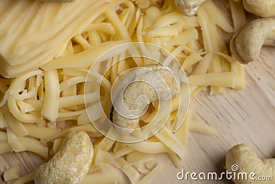 Sliced and grated hard cheese with cashew nuts Stock Photo