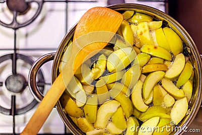 Sliced green apples in a pan to make apple compote Stock Photo