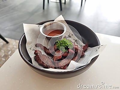 Grilled meat bowl with sauce. Stock Photo