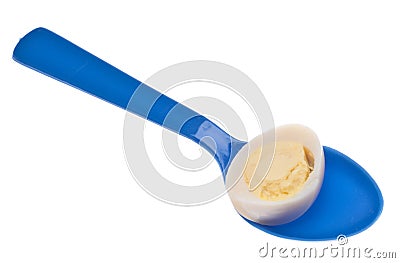 Sliced Hard Boiled Quail Egg on a Spoon Stock Photo