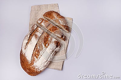 Sliced Homemade Wheat Bread are Lying on Linen Napkin Blue Background Minimalism Top View Tasty Homemade Bread Horizontal Stock Photo