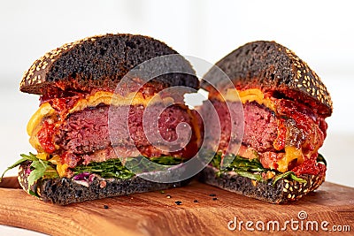 Sliced juicy cheeseburger Stock Photo