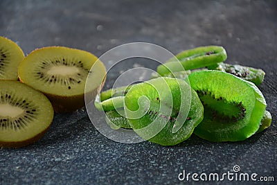 Sliced kiwi fruit in pieces fresh and dried Stock Photo