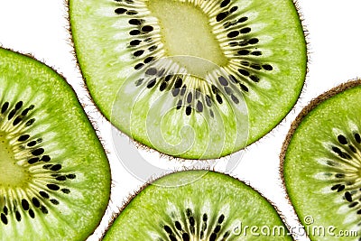 Sliced kiwifruit rings on white background top view macro Stock Photo