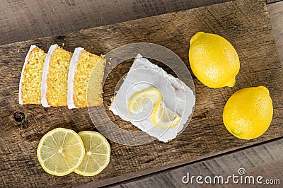 Sliced lemon pound cake with white icing Stock Photo