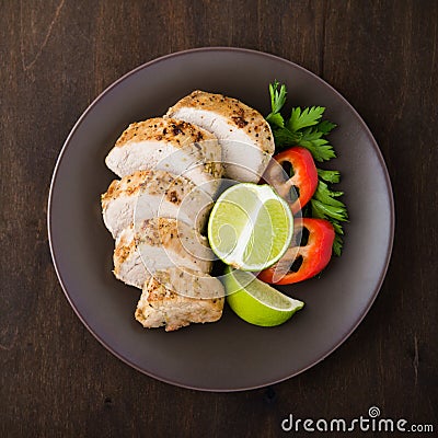 Sliced lime pork tenderloin with vegetables salad top view Stock Photo