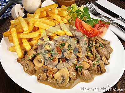Fine Meat - Sliced Meat Zurich Style with French Fries Stock Photo