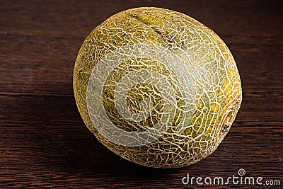 Sliced melon on dark wooden table Stock Photo