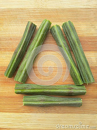 Sliced moringa oleifera triangle on wooden background Stock Photo