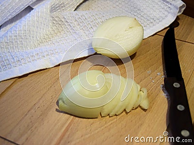 sliced onion in half rings on a wooden Board medium plan Stock Photo