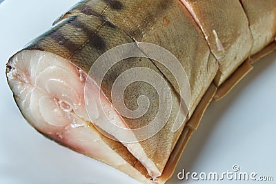 A piece of cold smoked mackerel on a white plate Stock Photo
