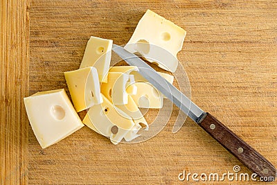 Sliced portion of regional Dutch Maasdam cheese Stock Photo