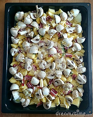 Sliced potatoes, mashrooms and bacon Stock Photo