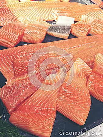 Sliced raw salmon or fresh salmon. Salmon fillets for sale at market displayed with a patchwork effect. Many fresh salmon fish Stock Photo