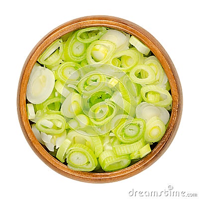 Sliced fresh scallions, chopped bulbs of green onions, in a wooden bowl Stock Photo
