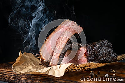 Sliced smoked beef brisket with dark crust from classic Texas BBQ Stock Photo