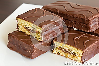 Sliced sponge cake in chocolate Stock Photo