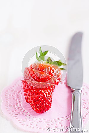 Sliced strawberry and knife Stock Photo