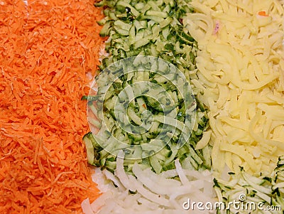 Sliced vegetables. Cheese, onions, cucumber, carrot cutting into strips Stock Photo