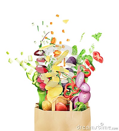 Sliced vegetables flying from a paper bag Stock Photo