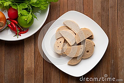 Sliced vietnamese pork sausage in white plate.asian food.Top view Stock Photo