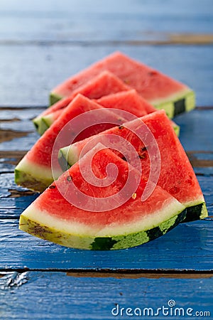 Sliced watermelon closeup. Many slices on an old rustic blue tab Stock Photo