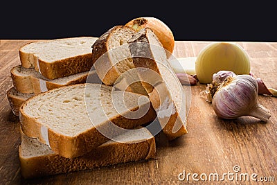 Sliced white bread with wheat flour on a wooden table. Chamado PÃ£o de forma Stock Photo