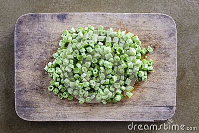 Sliced yard long bean vegetable on wooden block.long bean preparation in thai kitchen Stock Photo