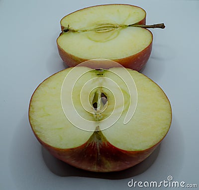 sliced ??yellow apple fruit with visible seeds and insides Stock Photo