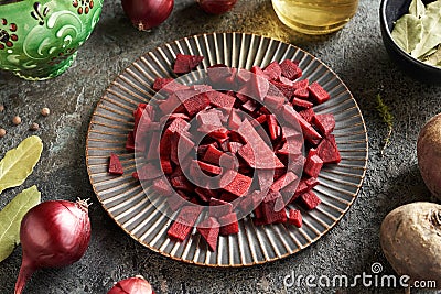 Slices of beetroot on a black plate - preparation of fermented beet kvass Stock Photo