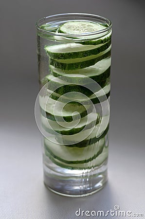 Slices of cucumber in a glass of water Stock Photo