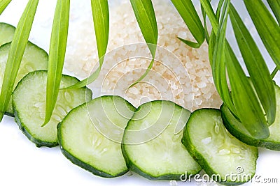 Slices of cucumber with sea salt isolated on white Stock Photo