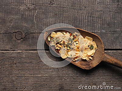 Slices of dried garlic with spicy herbs , view from above Stock Photo