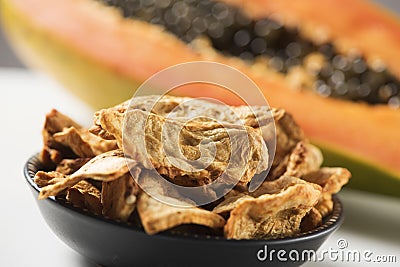 Slices of dried papaya served as appetizer or snack Stock Photo