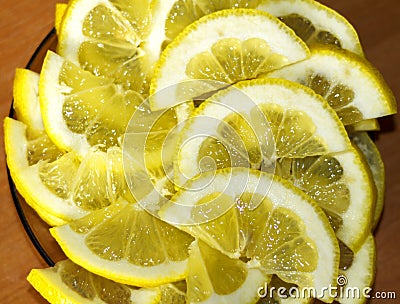 A slices of fresh yellow lemon texture background pattern. Stock Photo