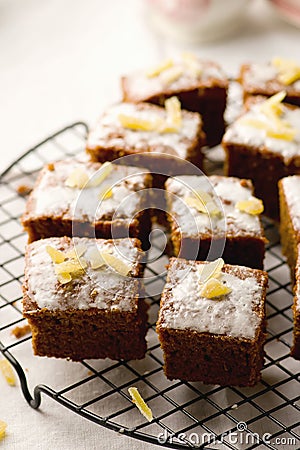 Slices of a ginger parkin on a lattice for cooling. Stock Photo