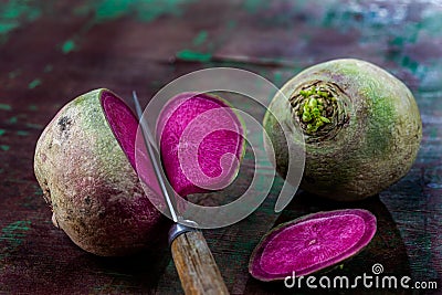 Slices of green and pink radish and purple Blue Meat radish Stock Photo