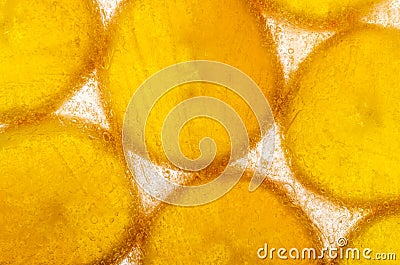 Slices of orange frozen in ice Stock Photo