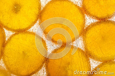 Slices of orange frozen in ice Stock Photo