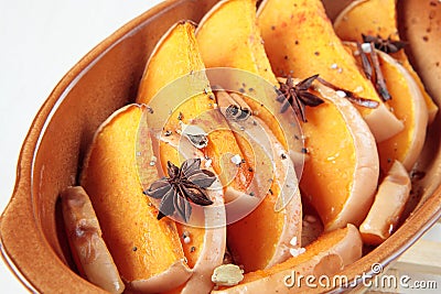 Slices of pumpkin baked with dittany, cardamom Stock Photo