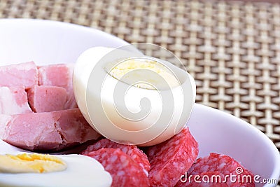 Slices of salame from tuscany and egg Stock Photo