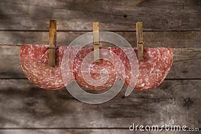 Slices of salami hanging Stock Photo