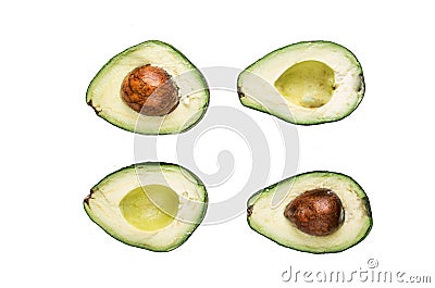 Slices of with seed of avocatto on a white Stock Photo